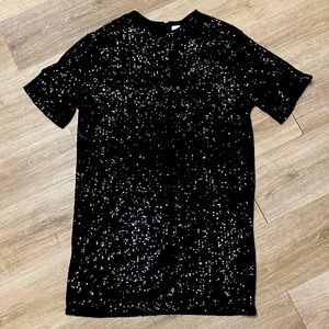 Beautiful black sequin short sleeve dress. Never worn.
